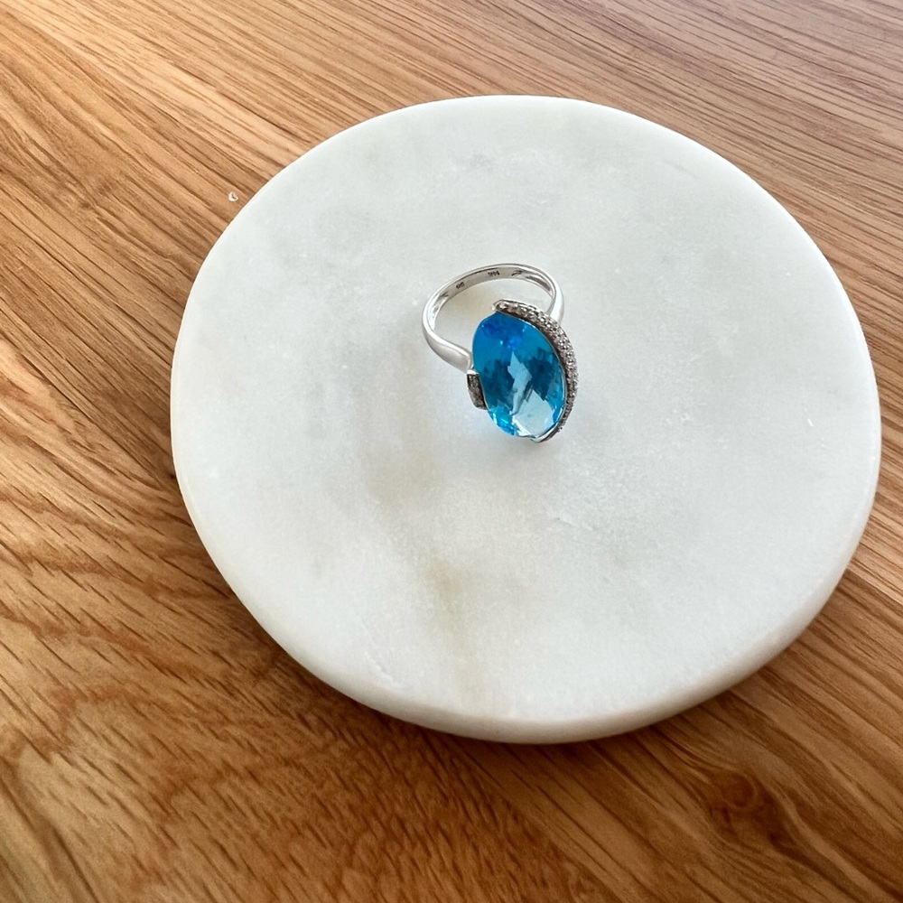 Blue topaz ring with diamond half halo